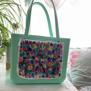 Mint green medium bogg bag with removable pouches.